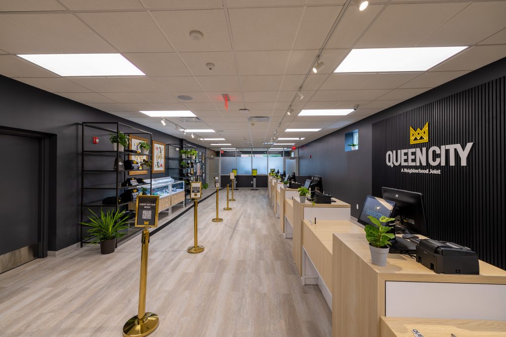 Queen City Dispensary store interior with registers and kiosks