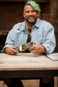 Happy man holding a Fernway vape package. 