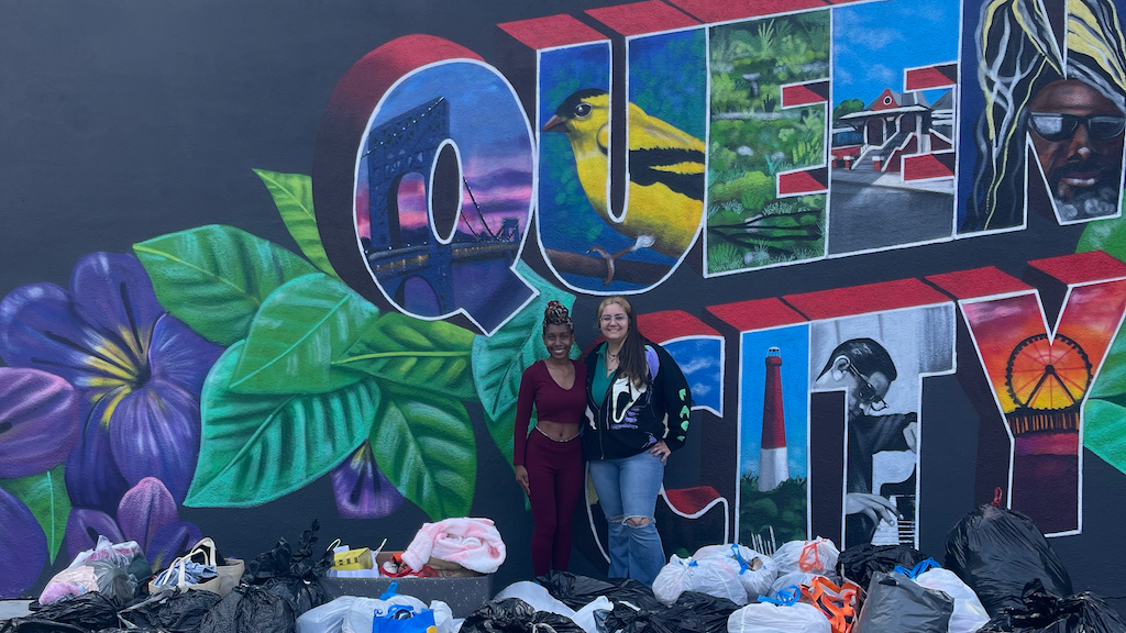 Two women at QCD's WHM clothing drive.