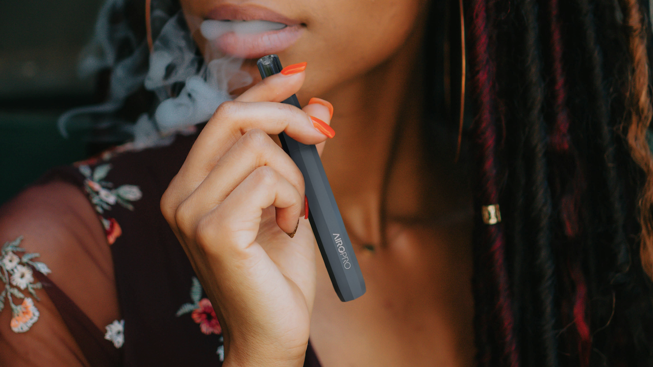 Woman smoking an AIRO Vape.